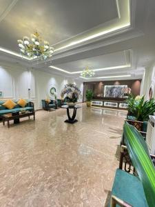 a large living room with couches and a table at Grand Hotel & Spa Bac Ninh in Ðồng Ky