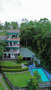 an aerial view of a house and a swimming pool at Green Hill Paradise Villa in Unawatuna
