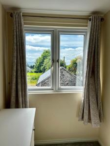 a window with a view of a vineyard at An Cnocán in Limerick