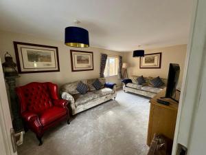 a living room with two couches and a television at An Cnocán in Limerick
