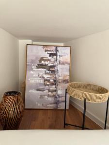 a room with two tables and a painting on the wall at Tivat Cozy Studio in Tivat +22 photos