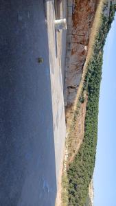 an aerial view of a wall next to a body of water at اطلالة سوف in Jerash
