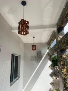 a staircase in a house with a chandelier at Kala's apartment farato in Medina Suware Kunda