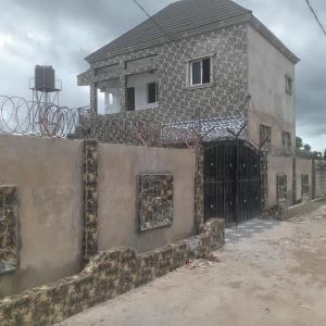 a house with a gate in front of it at Kala's apartment farato in Medina Suware Kunda