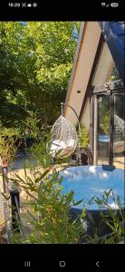 a bird bath sitting next to a house at A frame ti i ja in Smederevska Palanka