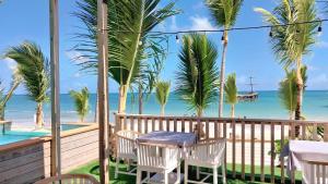 a view of the beach from the balcony of a beach house at Hotel Bloom Garden Beach Punta Cana in Punta Cana