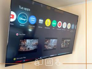 a screen on a wall with several different apps at Noth Central in Osorno