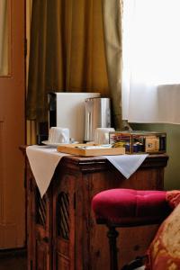 a wooden table with a counter top with a counter top at 41 Whitfield Street Hotel in London