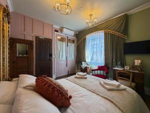 a bedroom with a large bed in a room at 41 Whitfield Street Hotel in London