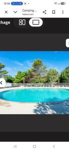 a screenshot of a picture of a swimming pool at Le petit paradis de la roque d'antheron in Jean-Jean