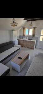 a living room with a couch and a coffee table at Jezerina in Šavnik