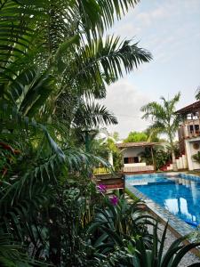 a view from the garden of a resort with a swimming pool at VILLA Fleurie in Mafia