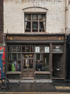 a store front of a brick building at 41 Whitfield Street Hotel in London