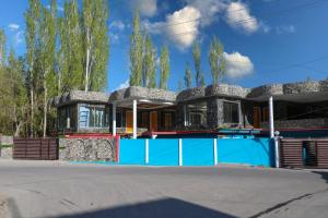 a house with a pool in front of it at Royal Brangsa in Skardu