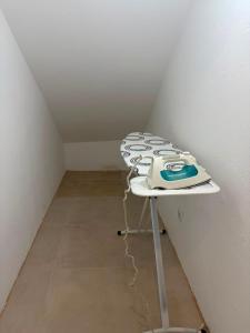 a phone sitting on a table in a room at Alojamento das cantarinhas in Bragança