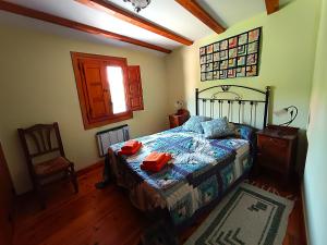 a bedroom with a bed and a chair and a window at Molino De Pradillo in Pradillo +27 photos
