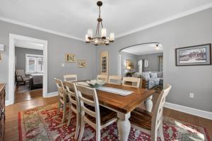 a dining room and living room with a table and chairs at Your Chicago Retreat in Chicago