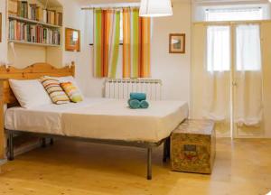 a bedroom with a bed and a book shelf at Authentic and Charming apartments between Cinque Terre and Portofino - Velva House in Velva