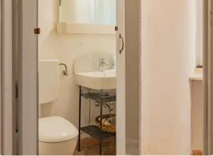 a bathroom with a toilet and a sink at Authentic and Charming apartments between Cinque Terre and Portofino - Velva House in Velva +13 photos