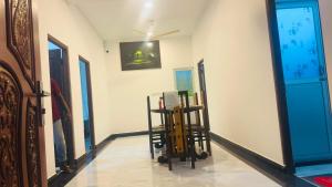 a room with chairs and a mirror on the wall at Nilaveli Beach Haven in Nilaveli
