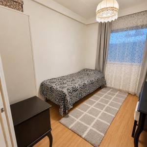 a bedroom with a bed and a window at Nordic City Home in Lahti