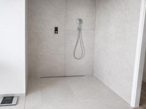 a shower with a shower head in a bathroom at Cosima in Hohenroth +76 photos