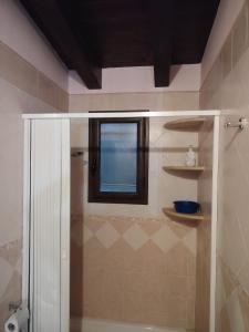 a bathroom with a shower and a window at La perla del mare in Santa Flavia +80 photos