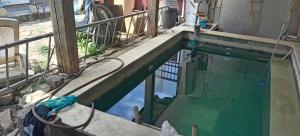 a swimming pool in the middle of a building at maison bleue in Belfort