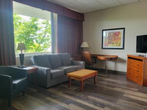 a living room with a couch and a table at Atlantis Inn in Rehoboth Beach