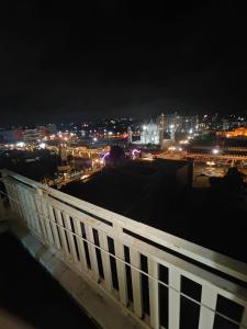 a view of a city at night with lights at Aura Vista in Bhopal