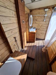 a wooden bathroom with a toilet and a sink at Agriturismo La Taverna in Fontanelice +61 photos
