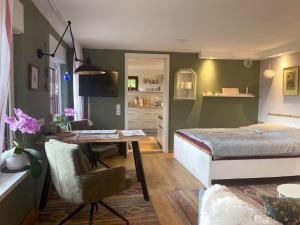 a bedroom with a bed and a desk and a deskablish at Ferienwohnung Lahntalblick in Weilburg