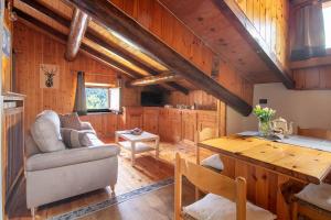 a living room with a couch and a table at The WoodHouse in Livigno