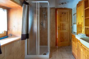 a bathroom with a shower and a sink at The WoodHouse in Livigno +16 photos