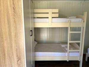 a couple of bunk beds in a small room at Miarla Rooms in Borsh +10 photos