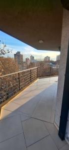 a view of a bridge with a city in the background at Apartamento Monte Grande Ameghino in Monte Grande