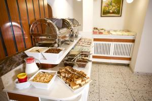a buffet line with many different types of food at The Central Hotel in Istanbul