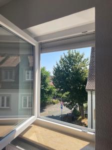 a window with a view of a street at Stadtmitte Kitzingen in Kitzingen