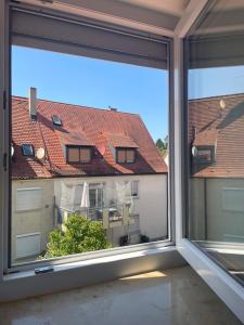 an open window with a view of a building at Stadtmitte Kitzingen in Kitzingen +12 photos