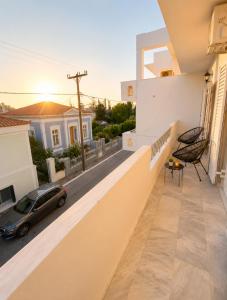 a view from the balcony of a house with a car at Aris Studios in Karlovasi