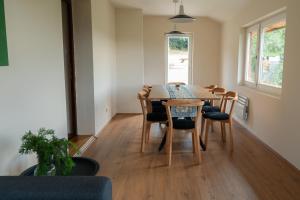 a dining room with a table and chairs at Casa Al Tramonto in Brestovi