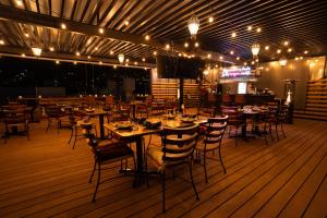a dining room with tables and chairs and lights at Kali Doña Tere in Acámbaro +25 photos