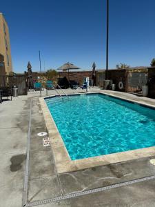 a swimming pool with blue water in a building at TownePlace Suites by Marriott Ridgecrest in Ridgecrest