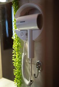 a hair dryer is attached to a wall at Solena Residences in Syvota