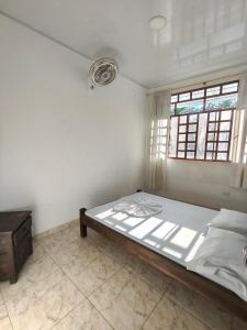 a bedroom with a large bed with a window at Villa Tania in Melgar +43 photos