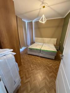 a bedroom with a bed in a room at Durres-apartament in Durrës