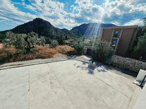 a house with a view of a mountain at Hikers place in Sutomore