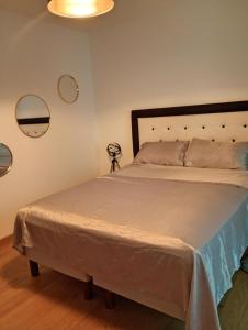 a bedroom with a large bed in a room at Iris in Valras-Plage