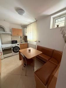 a living room with a couch and a table at GZP Residence Lugoj 2 in Lugoj