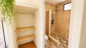 a bathroom with a shower and a toilet at Zen Village in Ko Phangan